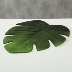 Pálmalevél alakú zöld színű design tányéralátét 46x38cm